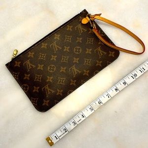 Louis Vuitton Neverfull Leather Clutch